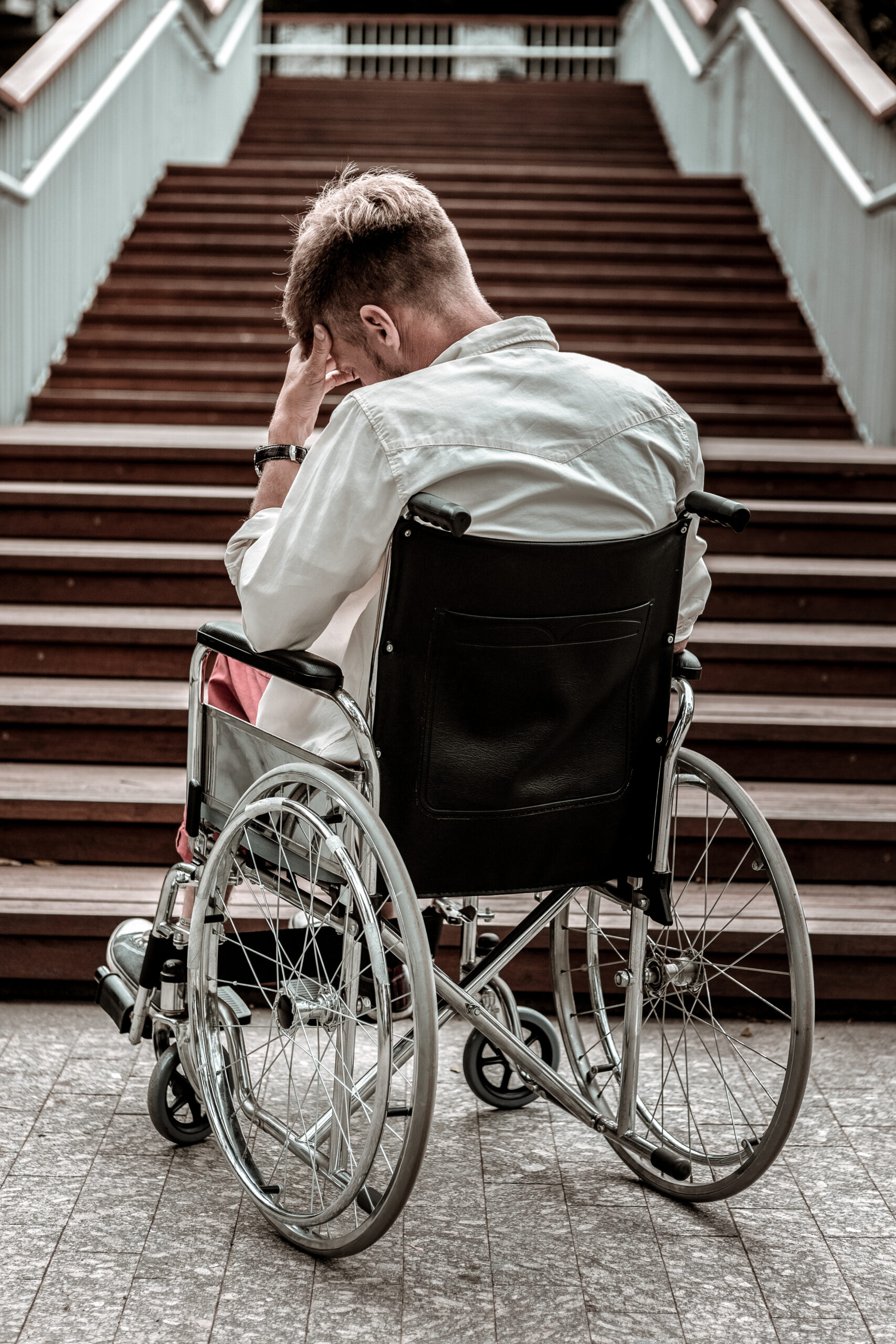 Invalid man closing his eyes and having difficulties Disability Discrimination